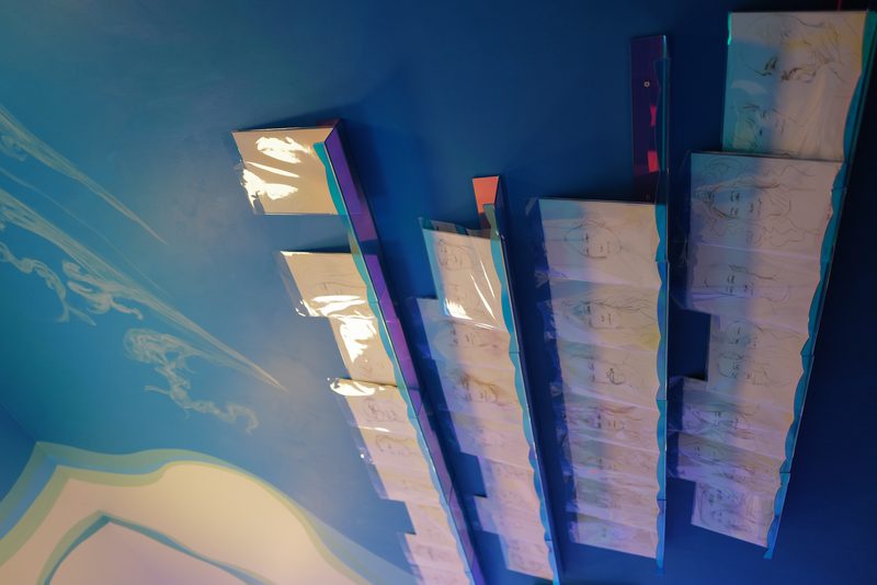 Faces In Miami — laser-printed portraits on holographic acrylic shelving